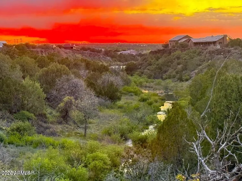 Sunset over Silver Creek with the creek bottom and neighboring Eagle Crest homes on the rim